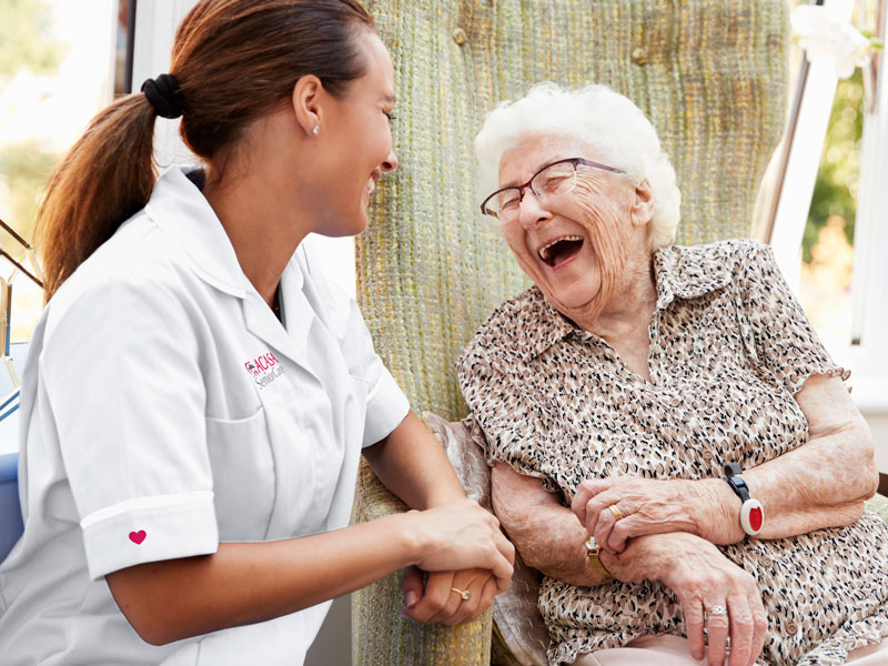 nurse laughing with patient